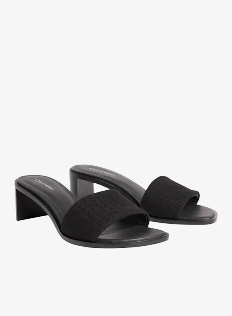 كالفن كلاين صنادل مارغي بكعب بتصميم شعار الجاكار